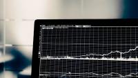 Computer displaying a graphic representation of multiple data sets.